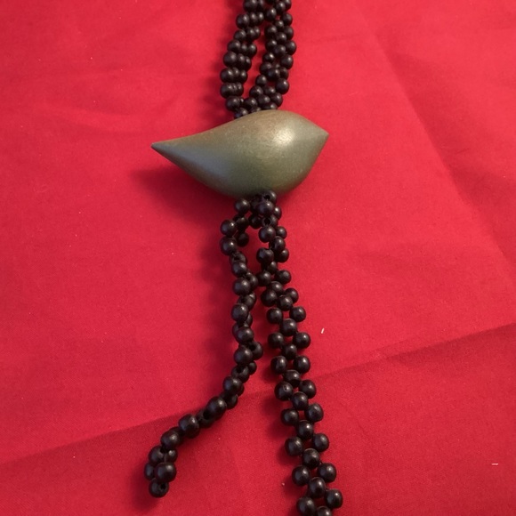 Long black beaded necklace with a bead shaped like a bird - Picture 3 of 5